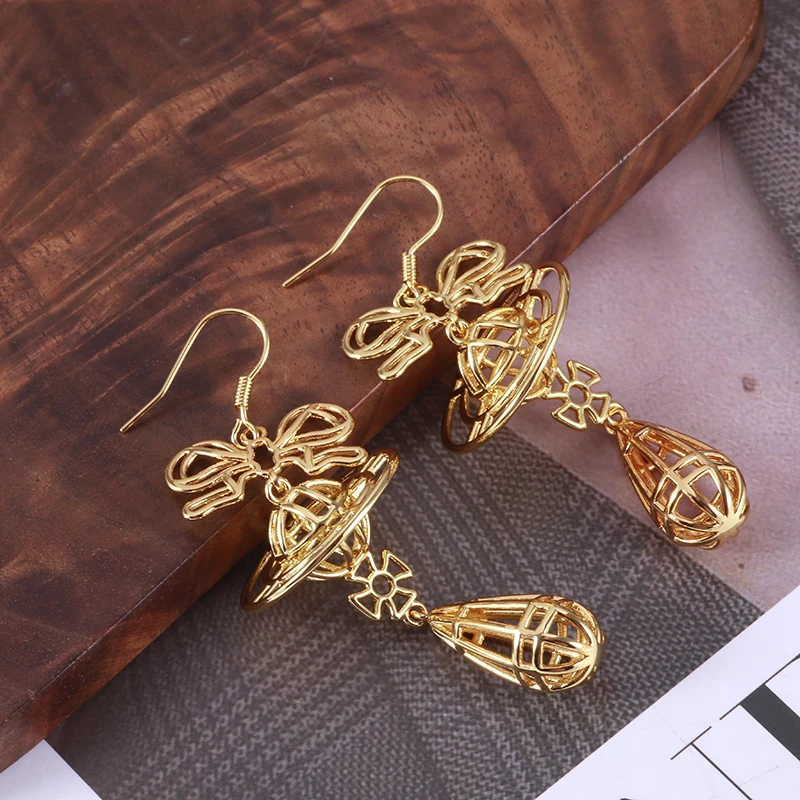 Hq полые серьги с бантом - Фотография_4