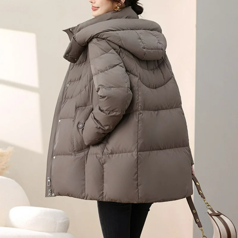 Женские пуховики средней длины с капюшоном - Фотография_5