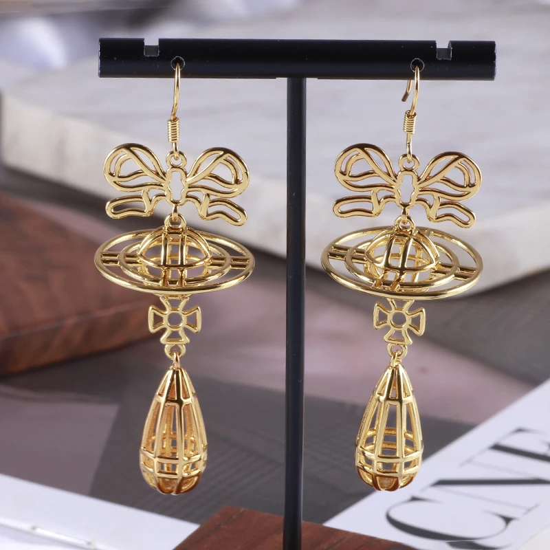 Hq полые серьги с бантом - Фотография_2